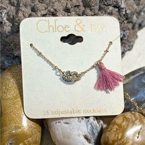 Chloe & Ivy Gold Necklace with Entwined Hearts & a Pink Tassel